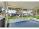 Screened patio with neighborhood views, offering a comfortable outdoor living space at 24802 Pine Hl, Leesburg, FL 34748