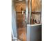Glass enclosed shower with brown tile surround and decor niche at 2504 Cavender Creek Rd, Minneola, FL 34715