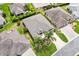 Aerial view of the home showing landscaping, driveway, and neighborhood homes at 2669 Halsey Ter, The Villages, FL 32162