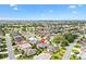 Very wide aerial view of the home within the community and golf course landscape at 2669 Halsey Ter, The Villages, FL 32162