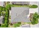 Aerial view of the home's roof, landscaping, and hardscape features in the backyard at 2669 Halsey Ter, The Villages, FL 32162