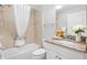 Well-maintained bathroom features granite countertop vanity and a shower/tub combo at 2669 Halsey Ter, The Villages, FL 32162
