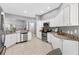 Spacious kitchen featuring granite countertops, stainless steel appliances and tile floors at 2669 Halsey Ter, The Villages, FL 32162