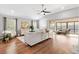 Relaxing living room with hardwood floors that opens to an outdoor living space at 2669 Halsey Ter, The Villages, FL 32162