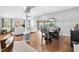 Open concept living space with wood floors flows from the dining area to the outdoor living space at 2669 Halsey Ter, The Villages, FL 32162