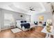 Spacious main bedroom features a tray ceiling, ceiling fan, hardwood floors, and plenty of natural light at 2669 Halsey Ter, The Villages, FL 32162