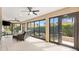 Relaxing enclosed patio with ceiling fans, comfortable furniture and garden views at 2669 Halsey Ter, The Villages, FL 32162