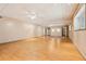 Spacious basement area with hardwood floors, ceiling fans, and recessed lighting, perfect for entertaining or recreation at 300 Carol Ann Dr, Edgewater, FL 32132