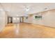 Large, finished basement with ceiling fans, laminate flooring, recessed lights, and two windows at 300 Carol Ann Dr, Edgewater, FL 32132