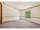 Spacious bedroom with neutral carpet, light walls and a ceiling fan at 300 Carol Ann Dr, Edgewater, FL 32132