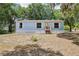 Charming one-story home featuring a well-lit front entrance and traditional window shutters at 300 Carol Ann Dr, Edgewater, FL 32132