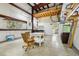 Spacious garage area with steel beams, concrete floor, and lots of natural light at 300 Carol Ann Dr, Edgewater, FL 32132