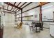 Bright and spacious garage with roll-up door, concrete floor, and room for storage at 300 Carol Ann Dr, Edgewater, FL 32132