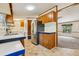 A view of the kitchen showcasing stainless steel appliances, and connecting rooms at 300 Carol Ann Dr, Edgewater, FL 32132
