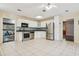 Bright kitchen featuring stainless steel appliances, white cabinets, and lots of storage space at 300 Carol Ann Dr, Edgewater, FL 32132