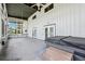 Spacious enclosed patio features a ceiling fan, a hot tub, and views of the surrounding yard at 300 Carol Ann Dr, Edgewater, FL 32132