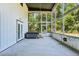 Covered patio features a ceiling fan, a hot tub, and screens to keep the bugs away at 300 Carol Ann Dr, Edgewater, FL 32132