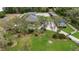 Expansive property features a pool, solar panels, and ample green space at 3055 Wolf Branch Rd, Mount Dora, FL 32757