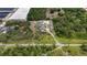 Large property with ample parking, including a pool, solar panels, and outdoor storage at 3055 Wolf Branch Rd, Mount Dora, FL 32757
