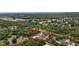 Expansive aerial view showcasing the property's estate and lush surroundings at 3055 Wolf Branch Rd, Mount Dora, FL 32757