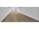 Large attic space with plush carpeting and a window, ideal for storage or conversion at 3055 Wolf Branch Rd, Mount Dora, FL 32757