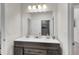 Bathroom featuring and sinks, new lighting, and plenty of vanity storage at 3055 Wolf Branch Rd, Mount Dora, FL 32757