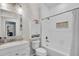 Bathroom featuring a shower-over-tub, vanity, and decorative tile work at 3055 Wolf Branch Rd, Mount Dora, FL 32757