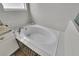 Modern bathtub with decorative tiling and natural light at 3055 Wolf Branch Rd, Mount Dora, FL 32757