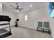 Spacious bonus room with exercise equipment, ceiling fan, and tile flooring at 3055 Wolf Branch Rd, Mount Dora, FL 32757