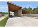 Large carport area with wooden frame at 3055 Wolf Branch Rd, Mount Dora, FL 32757