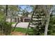 Elegant home with a paved driveway and a spacious three-car attached garage at 3055 Wolf Branch Rd, Mount Dora, FL 32757