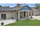 Elegant home with a covered porch that includes comfortable seating at 3055 Wolf Branch Rd, Mount Dora, FL 32757