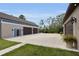 Large multi-car garage with additional parking pad, and custom carriage doors at 3055 Wolf Branch Rd, Mount Dora, FL 32757