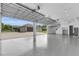 Spacious garage with high ceilings and glass paneled doors opening to the exterior at 3055 Wolf Branch Rd, Mount Dora, FL 32757