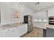 Well-lit kitchen featuring granite countertops and stainless steel appliances at 3055 Wolf Branch Rd, Mount Dora, FL 32757