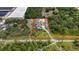 Aerial image of the property outlined in red showing property lines at 3055 Wolf Branch Rd, Mount Dora, FL 32757