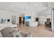 Spacious living room with a modern kitchen and a sliding barn door at 3055 Wolf Branch Rd, Mount Dora, FL 32757