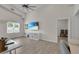 Open Living Space includes a large screen tv, lots of natural light, and workspace at 3055 Wolf Branch Rd, Mount Dora, FL 32757