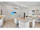 Living room featuring island, modern ceiling fan and lots of workspace at 3055 Wolf Branch Rd, Mount Dora, FL 32757