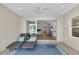 View from the outdoor patio into a light-filled home with hardwood floors and sliding glass doors at 3055 Wolf Branch Rd, Mount Dora, FL 32757