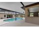 Screened in pool with spa and outdoor bar area with view into home at 3055 Wolf Branch Rd, Mount Dora, FL 32757