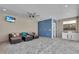 Outdoor pool house with a cozy seating area, TV, kitchenette, and full bathroom at 3055 Wolf Branch Rd, Mount Dora, FL 32757