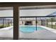Screened-in pool view with an outdoor kitchen area and covered seating at 3055 Wolf Branch Rd, Mount Dora, FL 32757