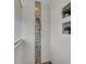 A modern walk-in shower with natural light, elegant tiling, and a rainfall showerhead at 3055 Wolf Branch Rd, Mount Dora, FL 32757