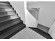Well-lit staircase with contrasting textures leading to upper and lower levels at 3055 Wolf Branch Rd, Mount Dora, FL 32757