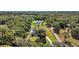 Expansive aerial view of the sprawling property, showcasing the estate's generous lot size and surrounding nature at 6905 Clayton St, Mount Dora, FL 32757