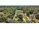 Expansive aerial view of the sprawling property, showcasing the estate's generous lot size and surrounding nature at 6905 Clayton St, Mount Dora, FL 32757