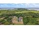 Beautiful home with an in-ground pool boasts amazing views of the lake, mature trees, and private surroundings at 6905 Clayton St, Mount Dora, FL 32757