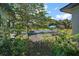 Lush backyard featuring mature trees and manicured garden spaces, perfect for outdoor relaxation at 6905 Clayton St, Mount Dora, FL 32757