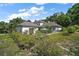 Spacious backyard with a refreshing pool, patio area, and meticulous landscaping at 6905 Clayton St, Mount Dora, FL 32757